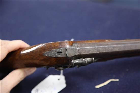 A pair of early 19th century percussion lock pistols, by Wogdon of London, 14in.